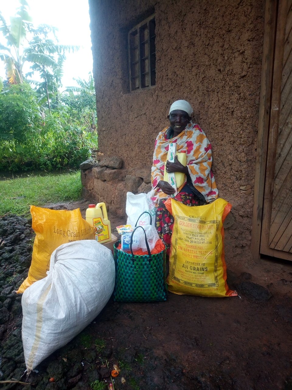 A woman sits with food she has received